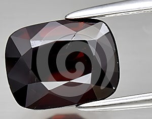 natural red spinel gem on the background