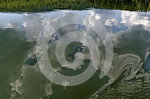 Natural reflection on Vlasina Mountain Lake and beautiful cloudy sky
