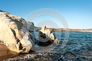 Natural Reserve in Sicily with turquoise sea and white limestone cliffs on a sunny day.