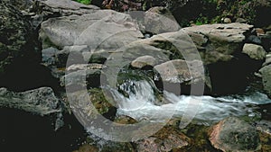 Natural river with clear water and mountain rocks