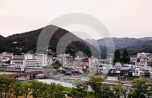 Natural river and mountain of Gero onsen resort town in Gifu, Japan - autumn season