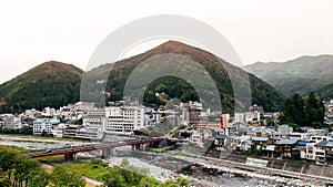 Natural river and mountain of Gero onsen resort town in Gifu, Japan - autumn season