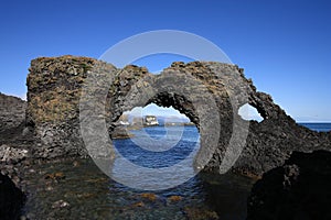 Natural rock arch in Iceland photo