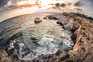 Natural rock arch near Ayia Napa at Cavo Greco natural park. Fam photo