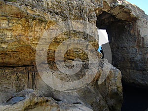 Natural rock arch with a sea erosion window on the Maltese Islands