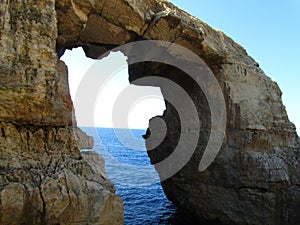 Natural rock arch with a sea erosion window on the Maltese Islands