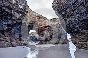 Natural rock arches Cathedrals beach, Playa de las catedrales at Ribadeo, Galicia, Spain