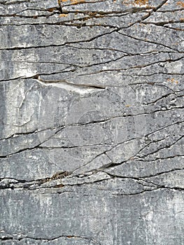 Natural rock face with fractures background