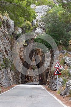 Natural rock tunnel on mountain road to Sa Calobra beach, Mallorca, Spain