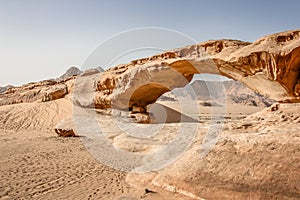 Natural rockbridge in Wadi Rum desert - Jordan