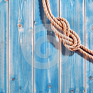 Natural Rope Double Figure Eight Knot on Blue Wood