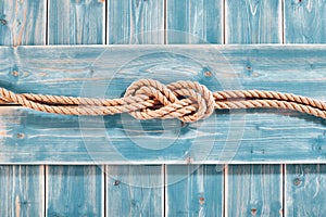 Natural Rope Double Figure Eight Knot on Blue Wood