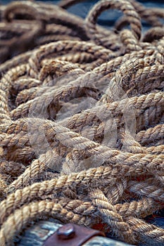 Natural rope old tangled piece of tackle background marine close up