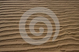 Natural sand pattern at a beach for background