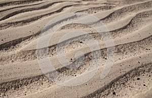Natural sand pattern created by a flow of tide and ripples