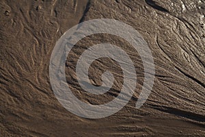 Natural sand pattern created by a flow of tide and ripples