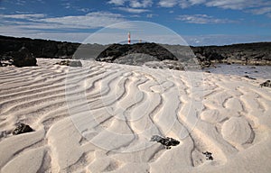 Natural sand pattern created by a flow of tide and ripples