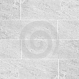 Natural sand stone tile wall seamless background and texture