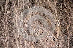 Natural sandstone rock rippled textured rock surface ideal as background