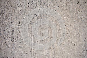 Natural sandy stone texture background. Sand texture of sandpile. Features of steps and Bicycle over white sand. Background.