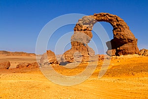 Natural sanstone arch in the Tadrart mountains. Algerian Desert. Tassili N`Ajjer National Park, Algeria