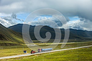 Natural scenery and Qinghai Tibet highway in the mountainous area of Qinghai Tibet Plateau in China