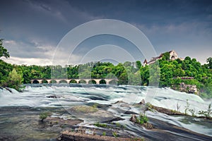 Natural Scenery of Rhine Falls and Swiss Church Culture at Schaffhausen City, Switzerland. Beautiful Nature Waterfront View of