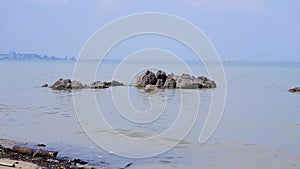 Natural scenery of rocks on the surface of the sea when it recedes