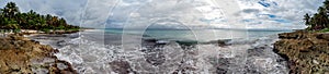 Natural seascape and beach panorama view in the tropical natural jungle forest palm in Tulum Mexico photo