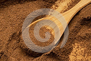 Natural seasoning, ground cinnamon, close-up top view.