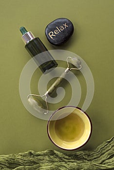 Natural Serum and oil for massage green background