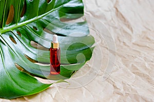 Natural Serums. Cosmetic hydrating serum in a glass bottle with pipette close up. Hyaluronic acid on abstract background top horiz