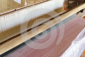 Natural silk farming and handcrafted manufacture of silk artifacts - handwoven ancient patterns in silk on traditional looms