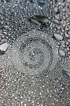 Natural silvery water dew drops texture macro background, vertical textured wet vapour bubble splashes pattern copy space, silver