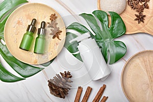 Natural skincare beauty product concept, Cosmetic bottle containers packaging with green herbal leaves