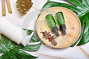 Natural skincare beauty product concept, Cosmetic bottle containers packaging with green herbal leaves