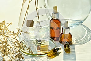 Natural skincare beauty products, Organic botany extraction serum oil and scientific laboratory glassware