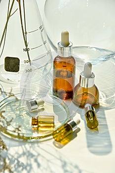 Natural skincare beauty products, Organic botany extraction serum oil and scientific laboratory glassware