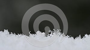 Natural snowflakes on snow, photo real snowflakes-Beautiful macro shot on winter and Christmas season.
