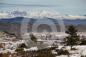 Natural snowy landscape with mountains of Gran Sasso in the back