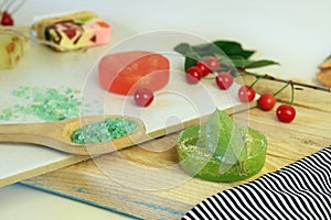 Natural soap, plants, sea salt on a light background, spa treatments