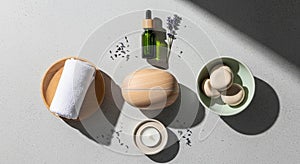 Natural spa elements are artfully arranged on a light gray surface