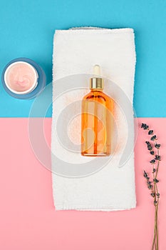 Natural spa oils. on a yellow-green background. open and closed buds, place for an inscription. flat lay photo