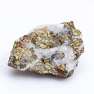 Natural stone chalcopyrite on a white background. Mineral of golden color on a white background