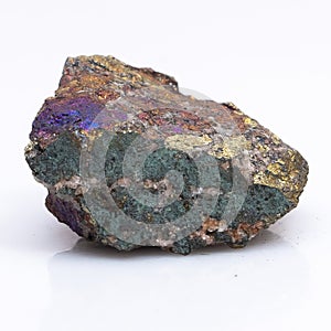 Natural stone chalcopyrite on a white background. Mineral of golden color on a white background