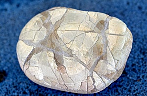 Natural stone with cross-shaped veins. macro close-up.