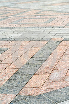 Natural stone laid on the pavement with a pattern