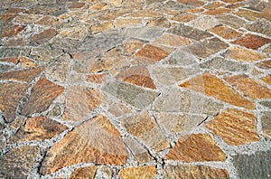 Natural stone pavement texture. Background from paving stones, irregular natural stones