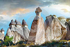 Natural Stone statues against a picturesque cloudy sky in Cappadocia