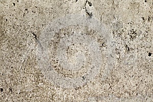 Natural stone surface with drips and dirt. Distressed texture in beige shades.